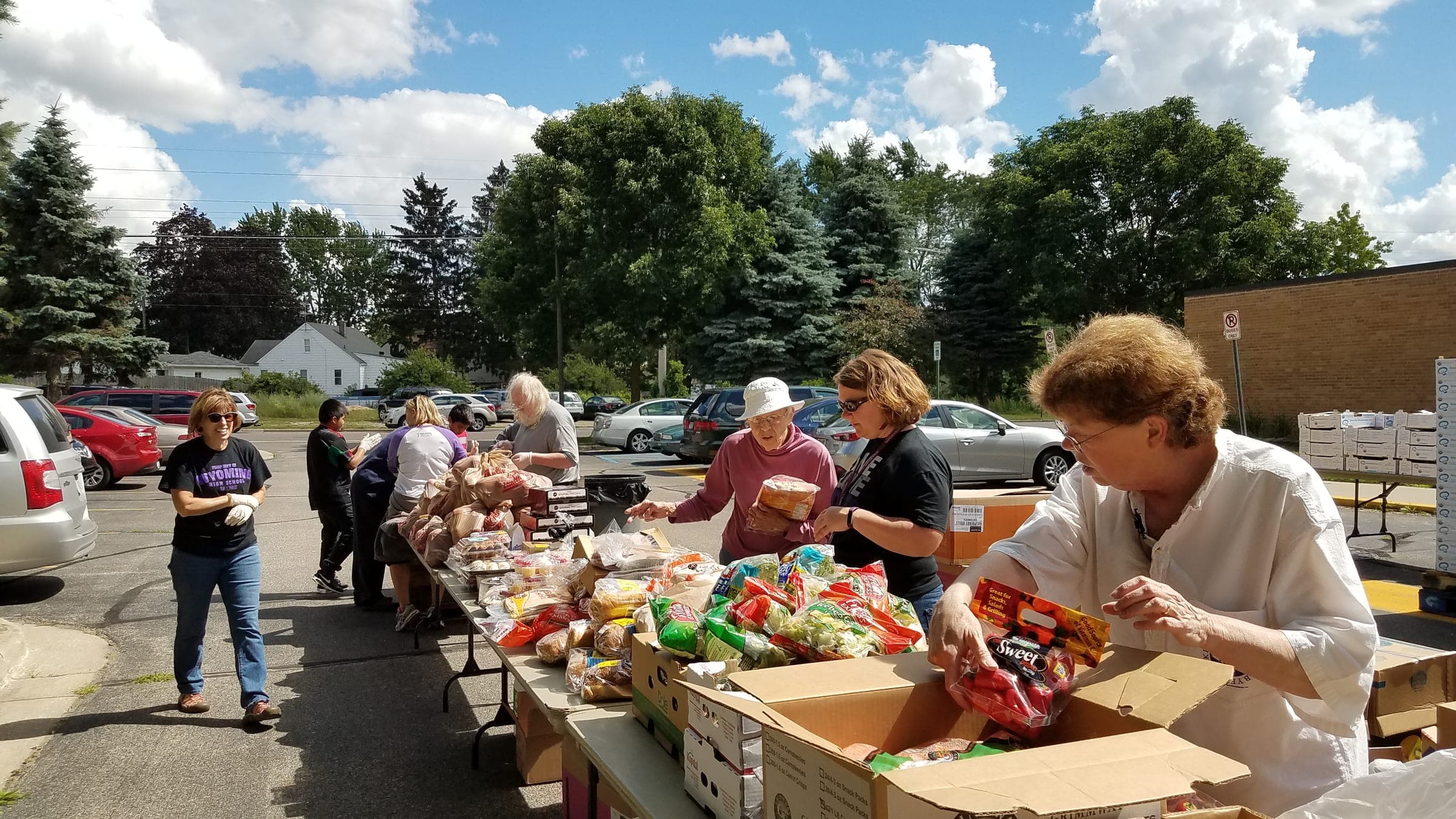 Volunteers distributing food at a community food drive