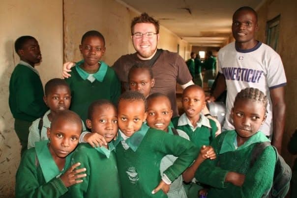 Lucas with students at a school